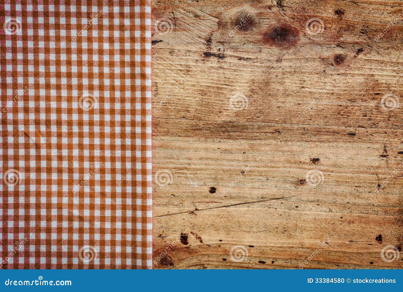 wood background with checked napkin