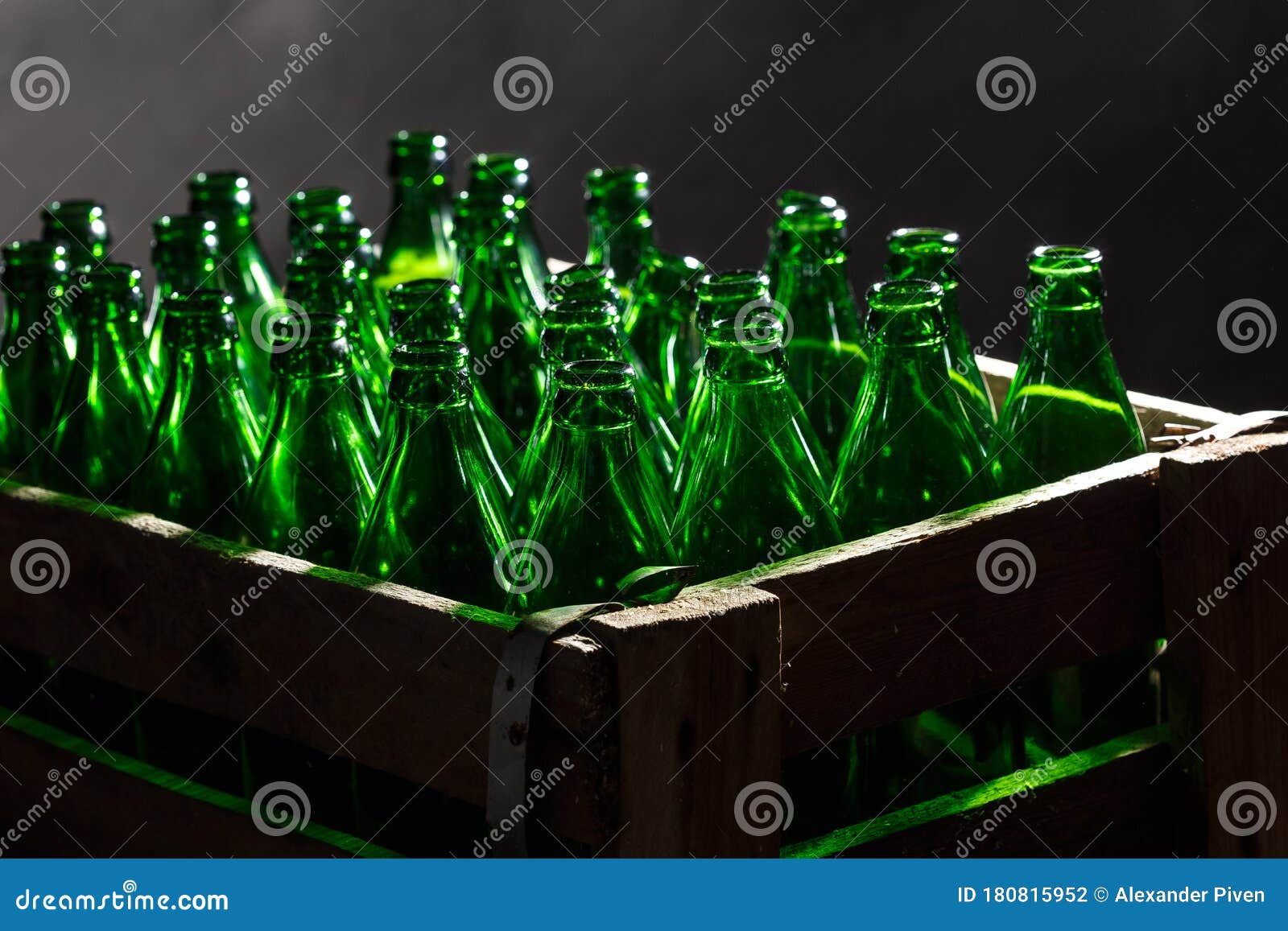 Wood Case with Empty Bottles on Black Background.Background Made from Empty Beer Bottles Stock