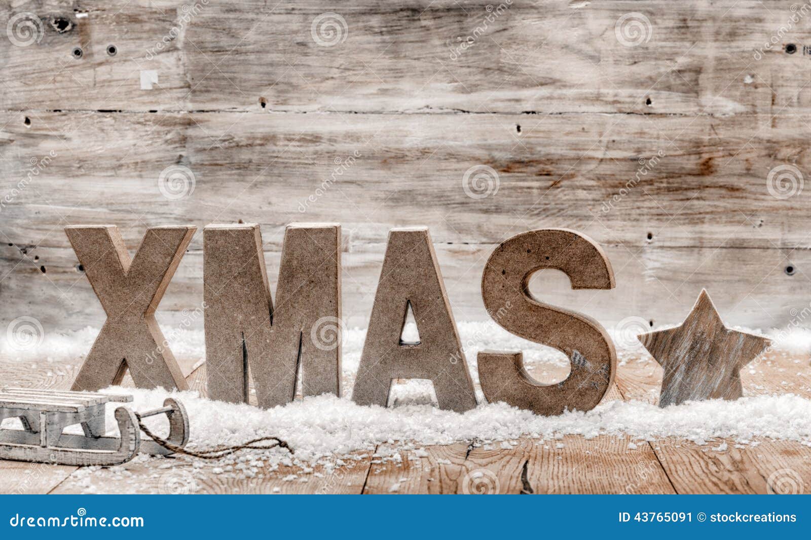 Wood craft rustic Christmas background with wooden letters spelling 