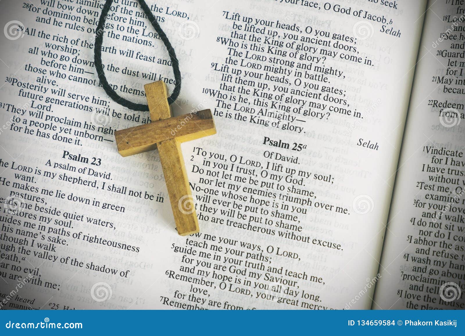 wood cross sign  and praying to god with a bible in the morning devotion