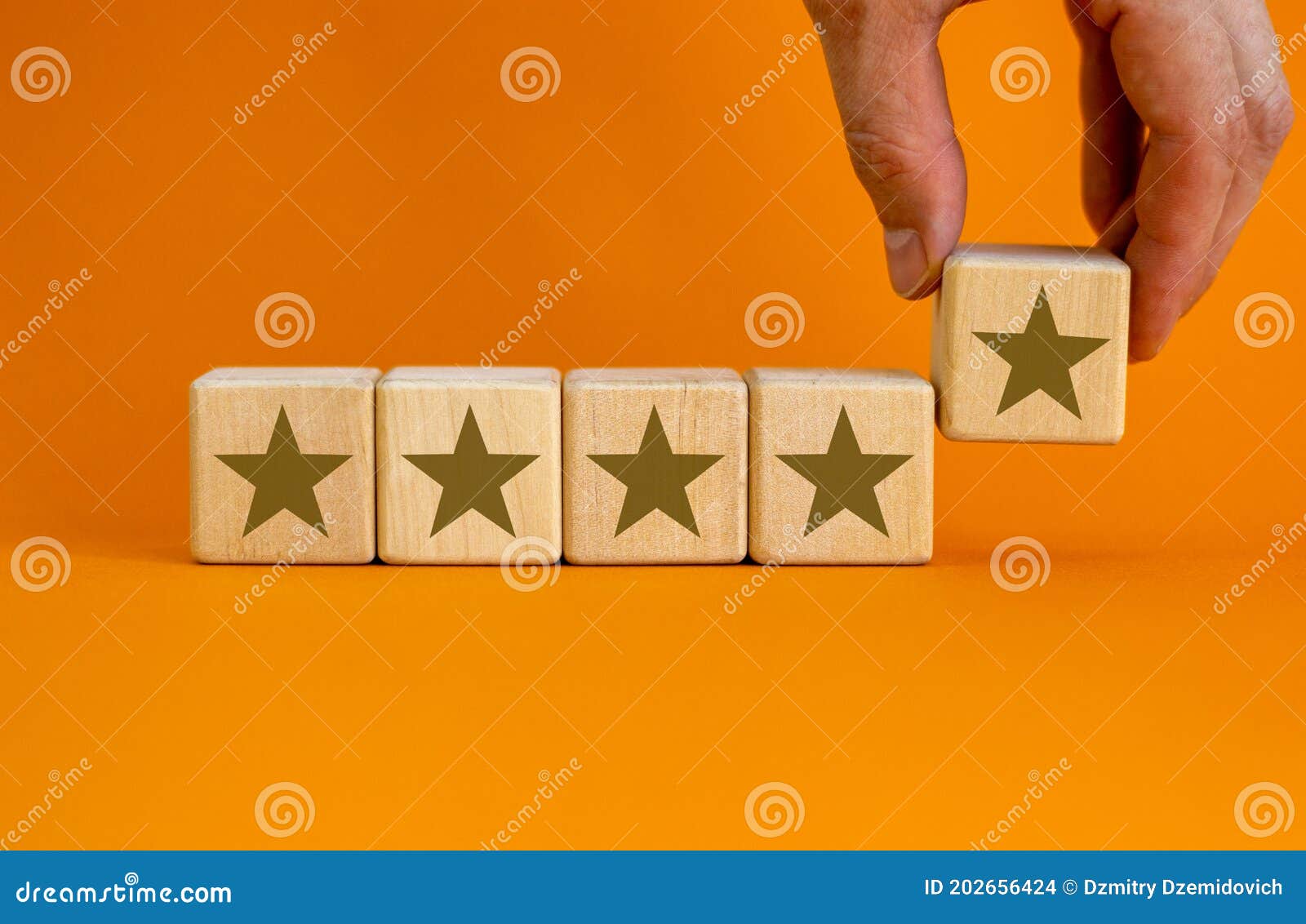 Wood Cubes with Gold Star Signs on Beautiful Orange Background ...