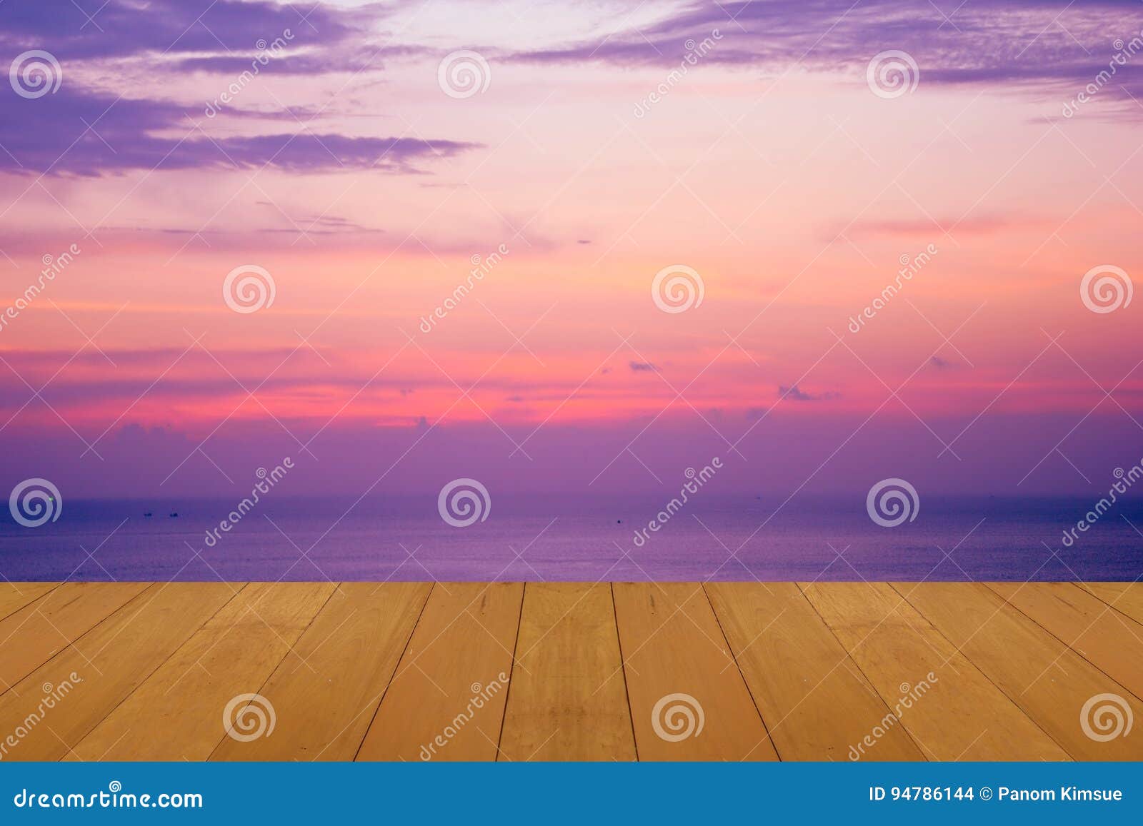 wood floor on sea with purple sunset burning skie beautiful natural tropical sea