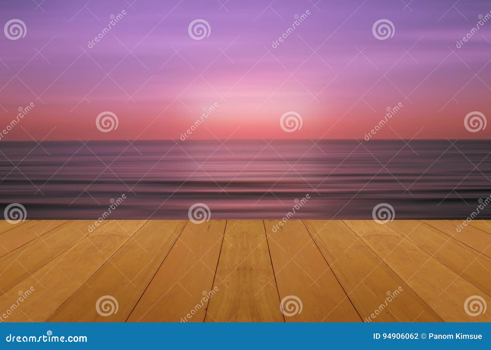 wood floor on sea with purple sunset burning skie beautiful natural tropical sea