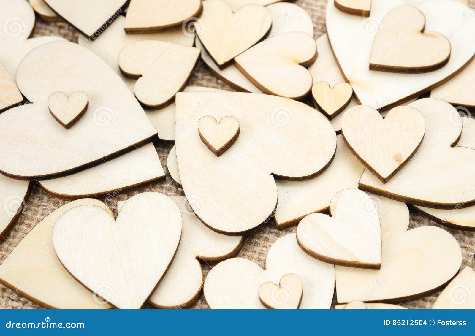 wood hearts on hessian texture background, valentine background