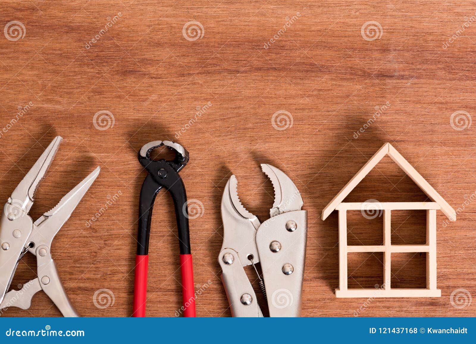 wood house skeleton with tool for fix problem on wood background