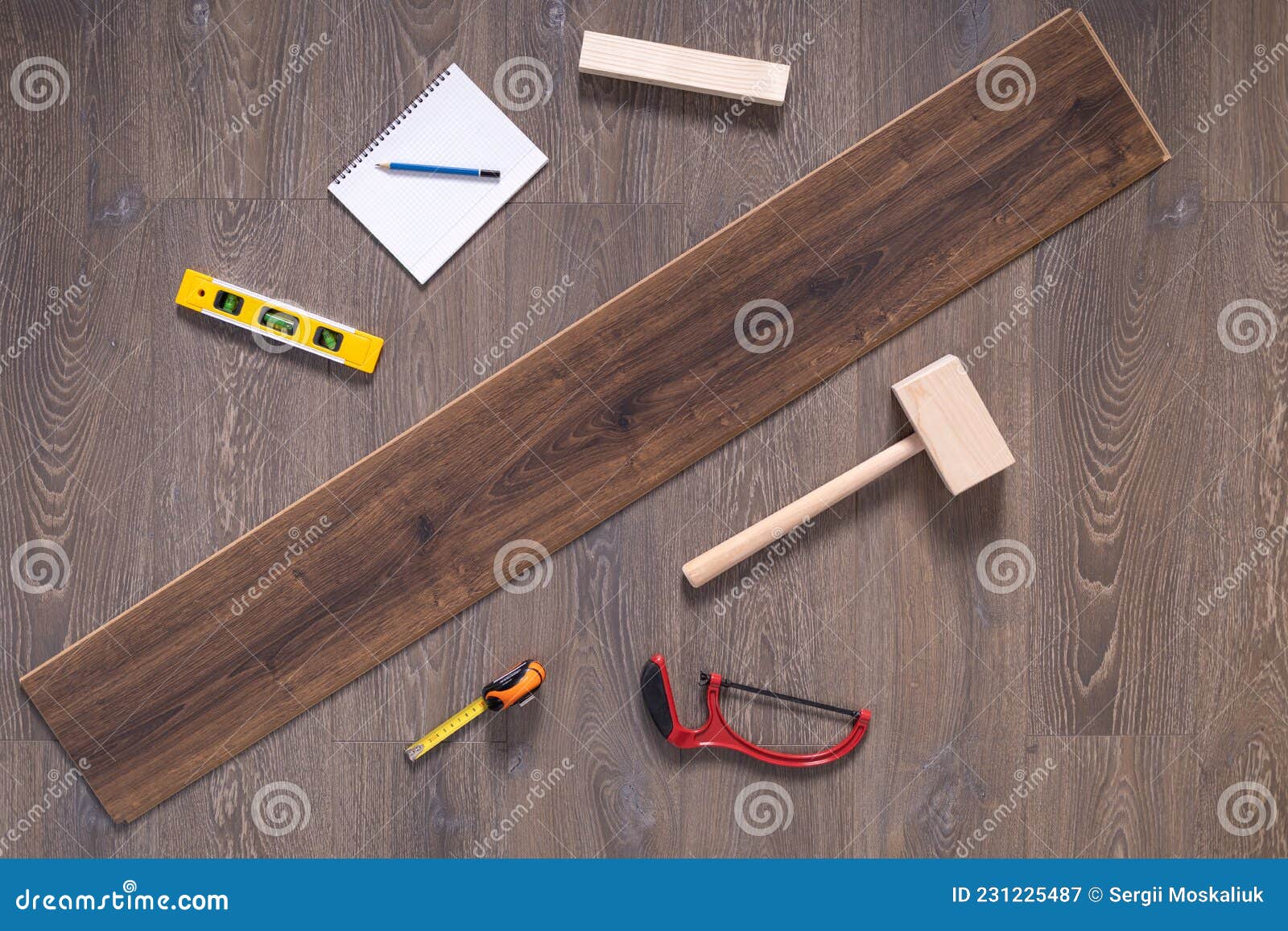 Wood Laminate Floor and Tools Background Texture. Wooden Laminate Floor