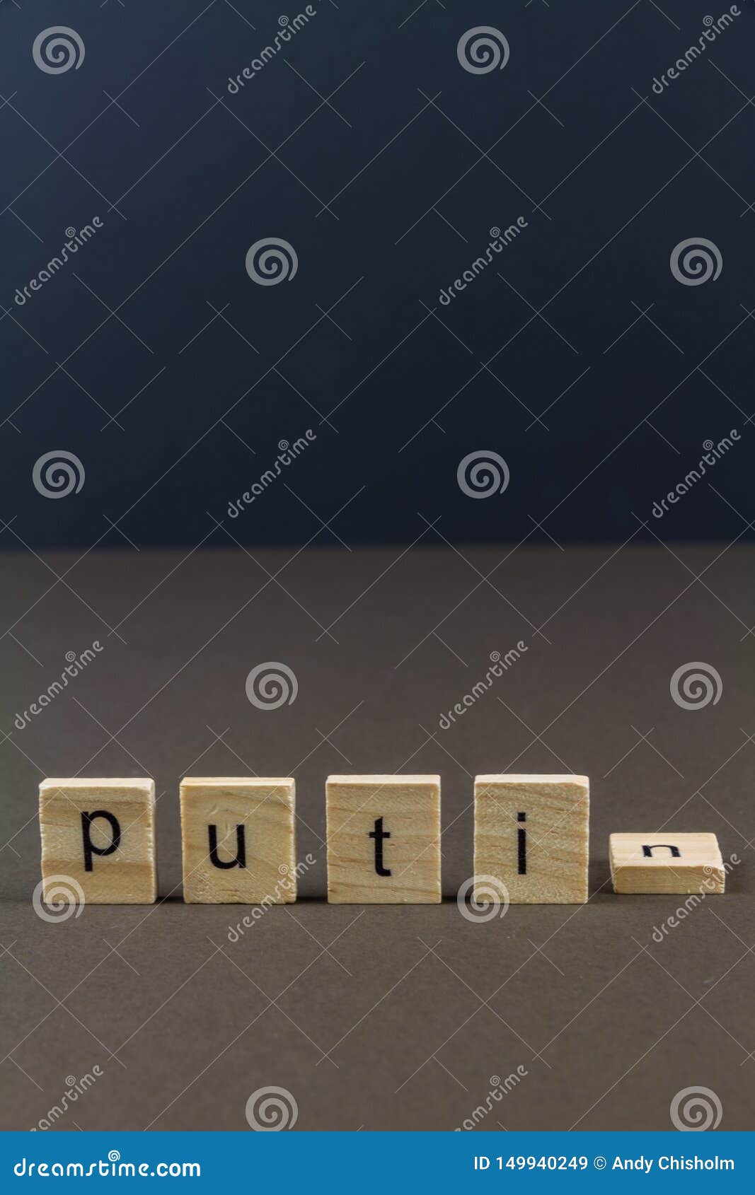 wood letter blocks spelling putin, n fallen, portrait