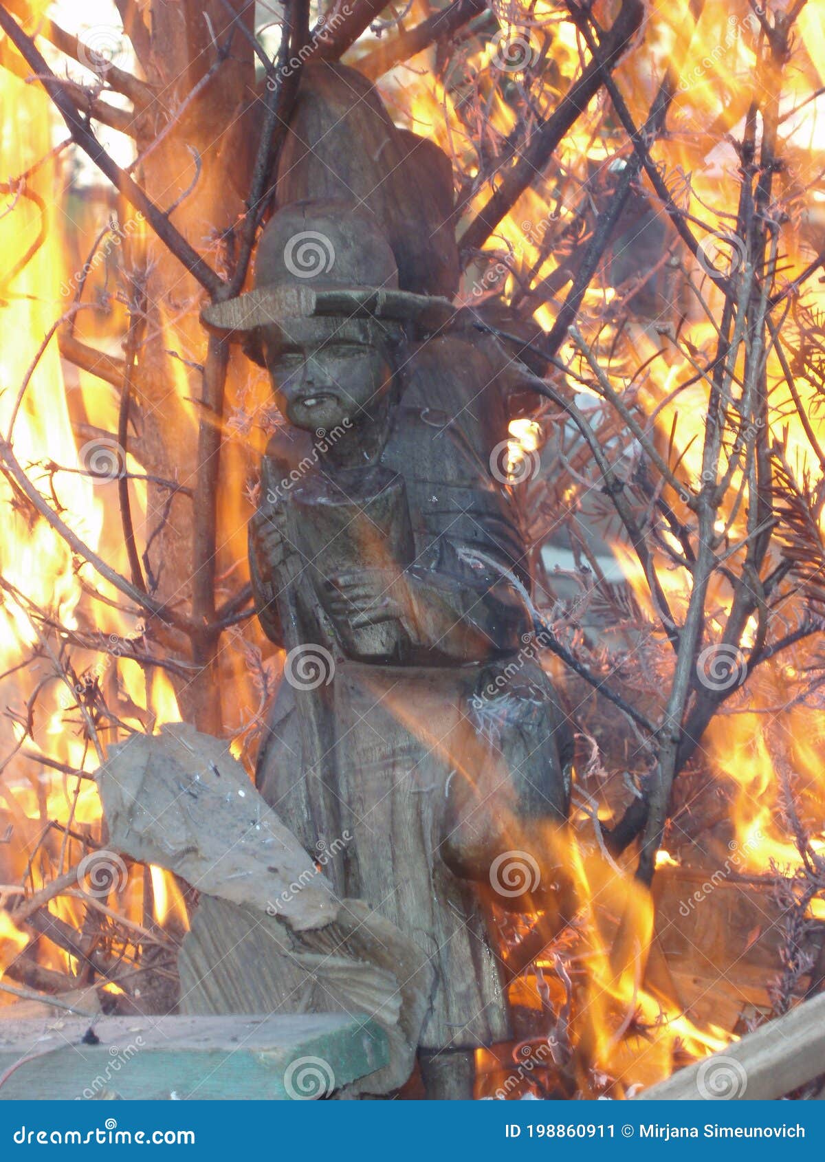 wood sculpture in fire