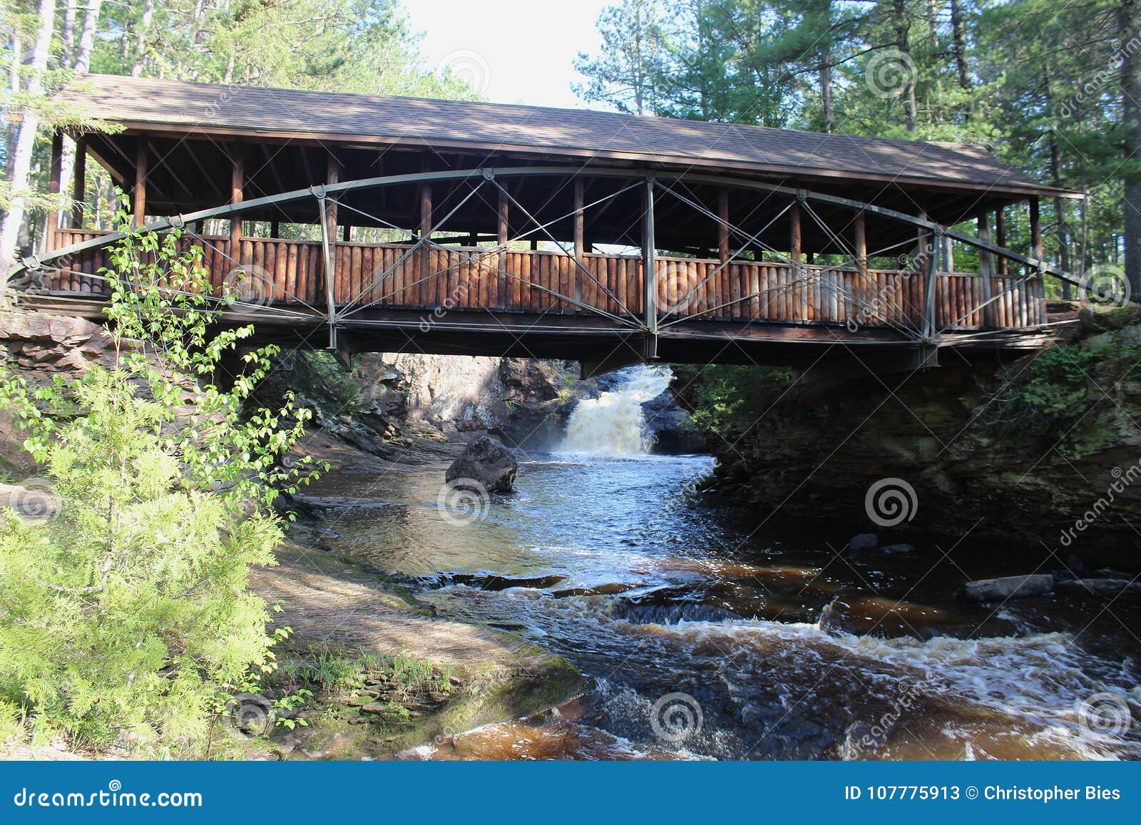 A Covered Bridge with a Waterfall Underneath Stock Image Image of stones, full 107775913