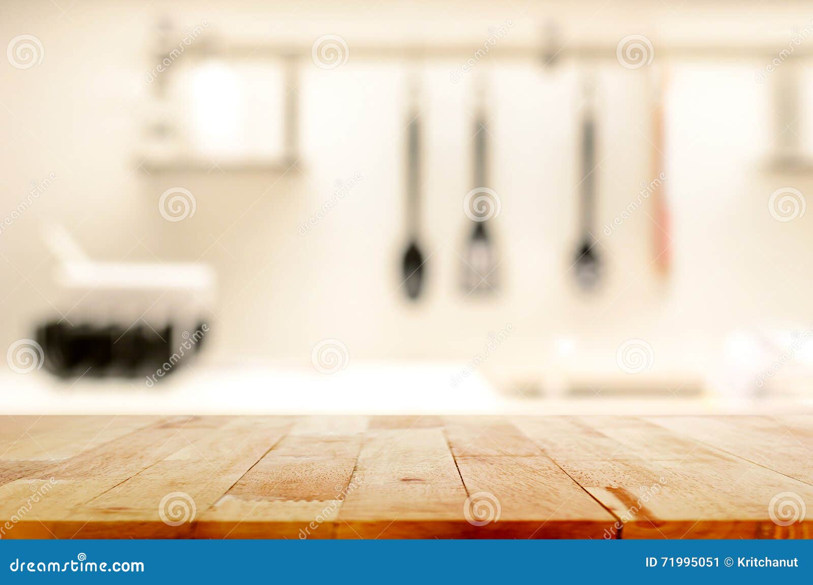 wood table top (as kitchen island) on blur kitchen background