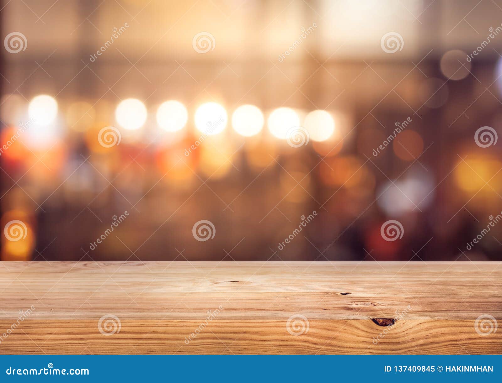 wood table top bar with blur colorful light bokeh in cafe,restaurant background