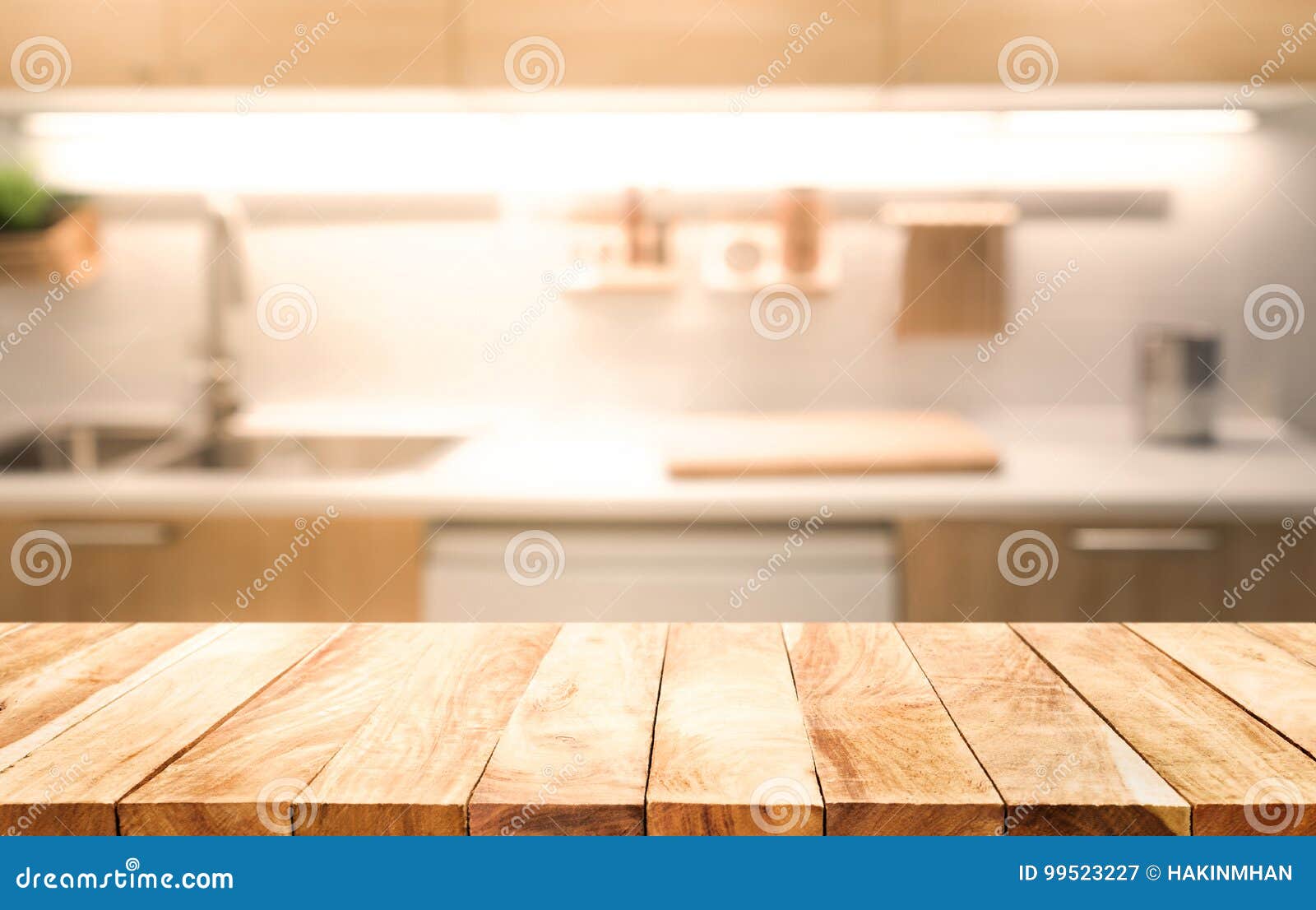 wood table top on blur kitchen room background cooking concept