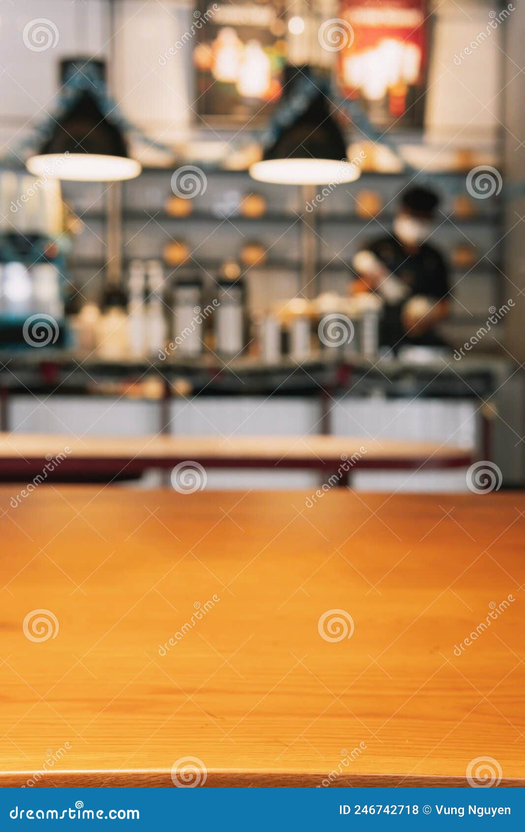 wood table top with blur of people in coffee shop or cafe,restaurant  background