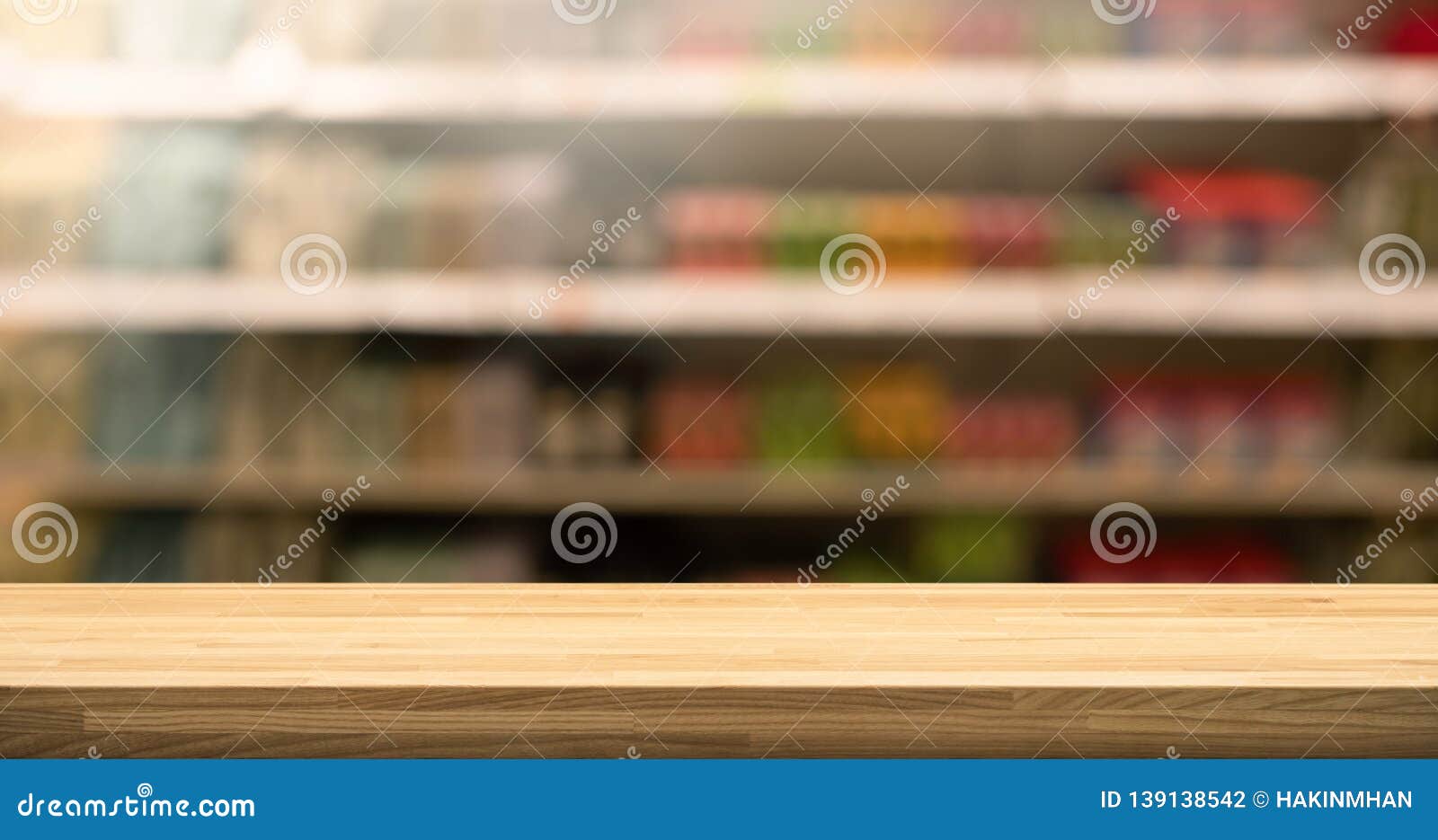 wood table top on blur of supermarket product shelf background