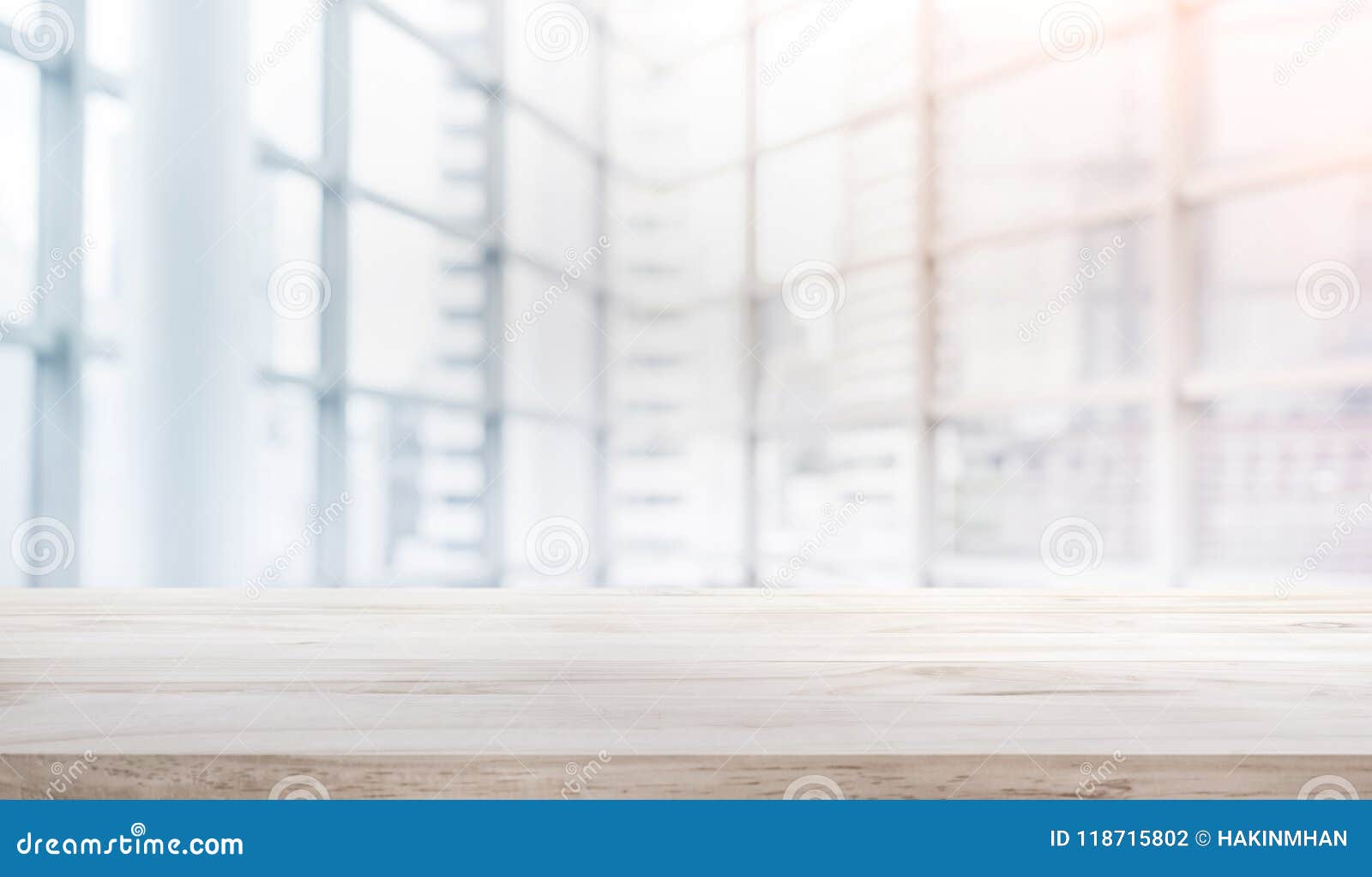 wood table top on blur white glass window background form office