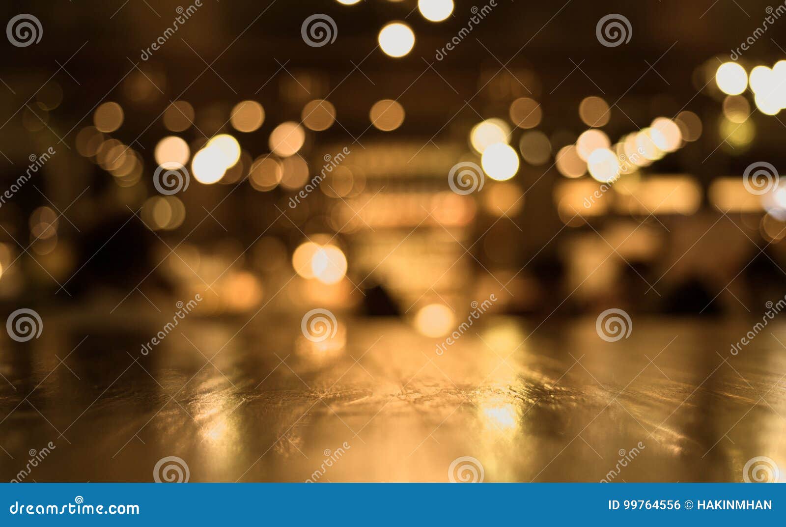 wood table top with reflect on blur of lighting in cafe,restaurant