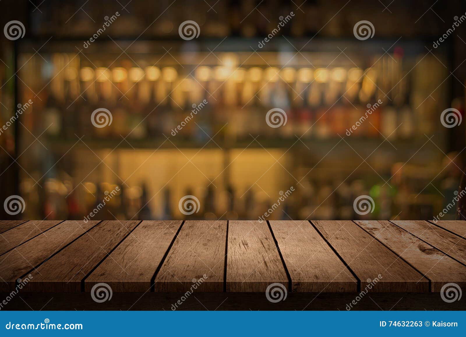 wood table with a view of blurred beverages bar backdrop