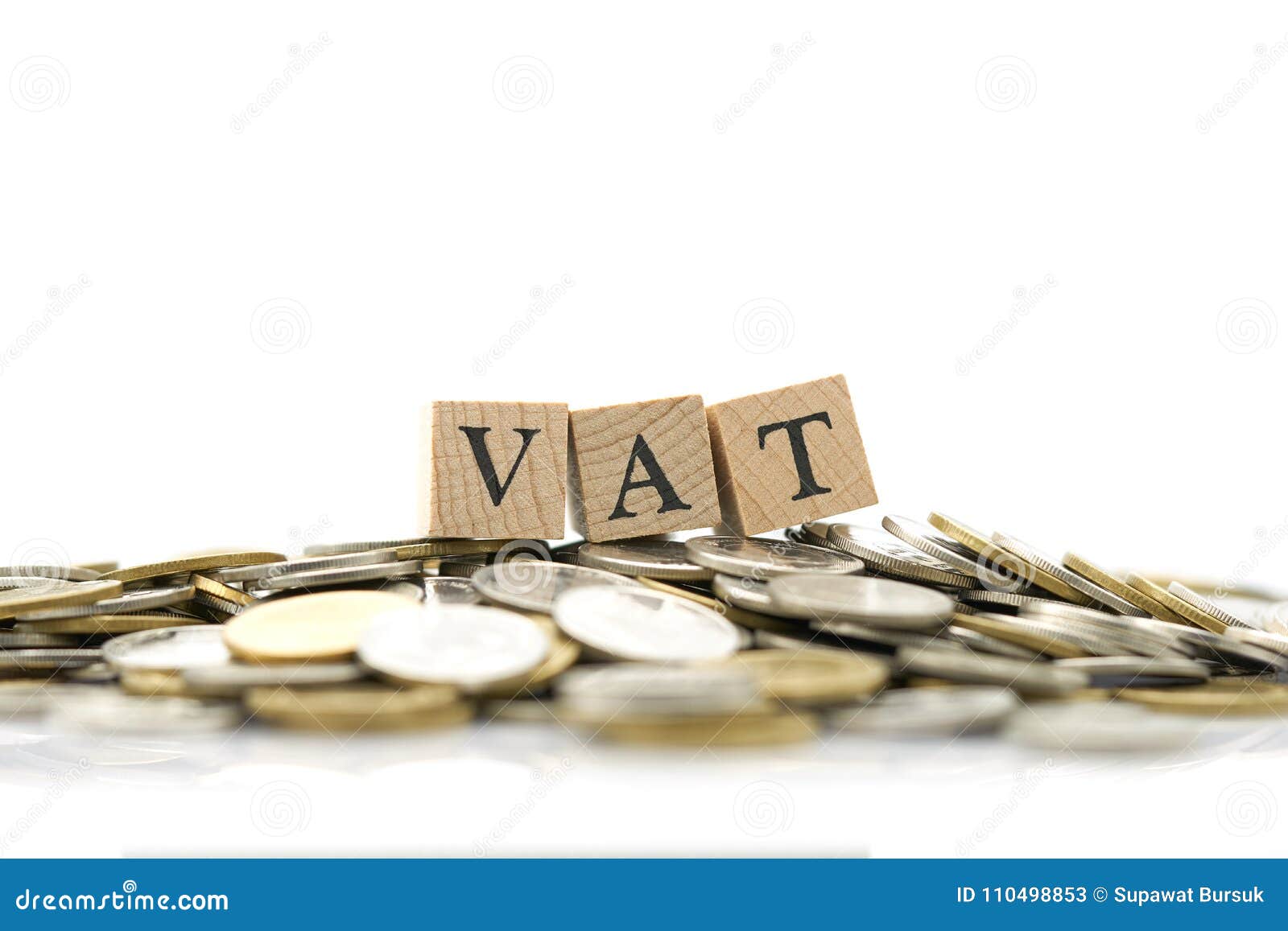 wood word vat is placed on a pile of coins.using as background business concept and finance concept with copy spaces