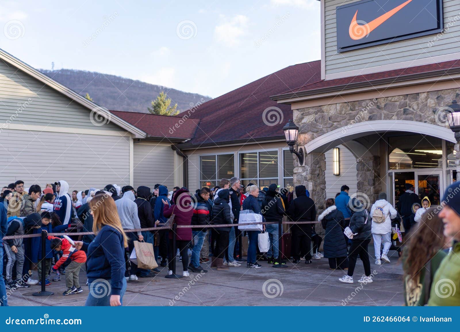 People Queuing in Line To Enter the Nike Store on Black Friday