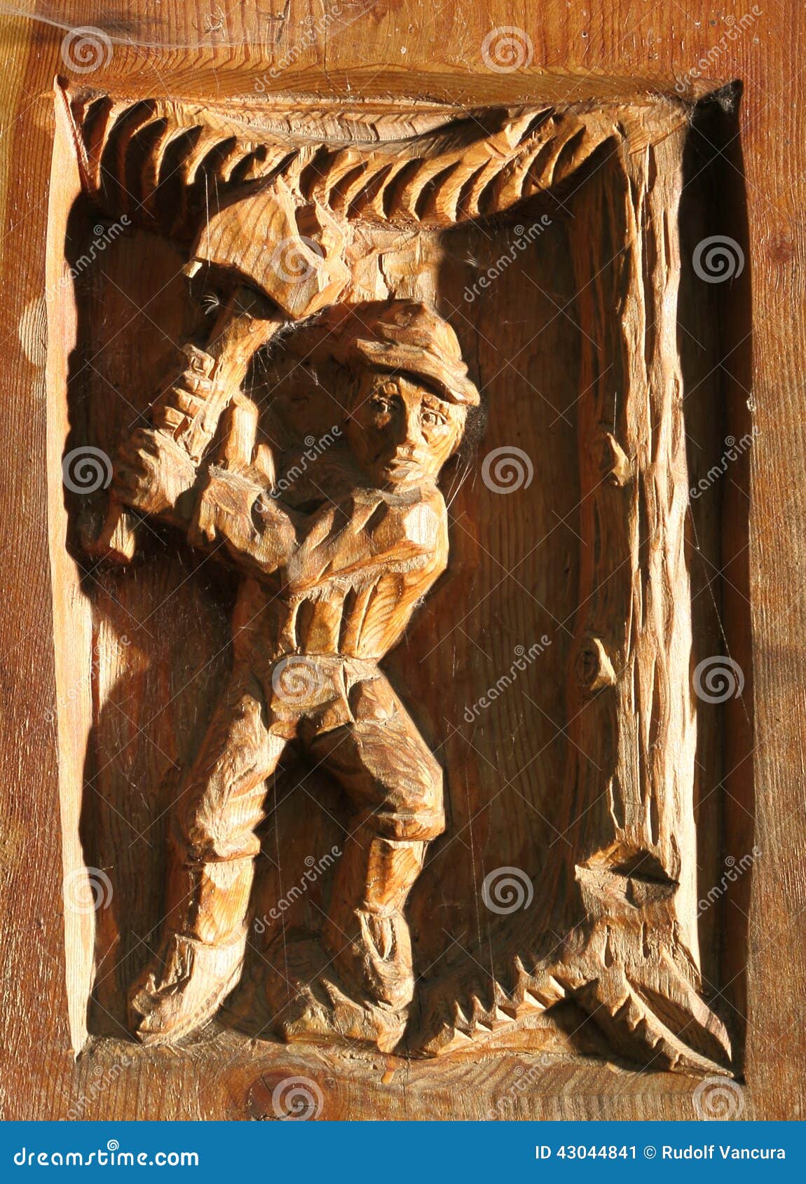 woodcarving of man chopping tree