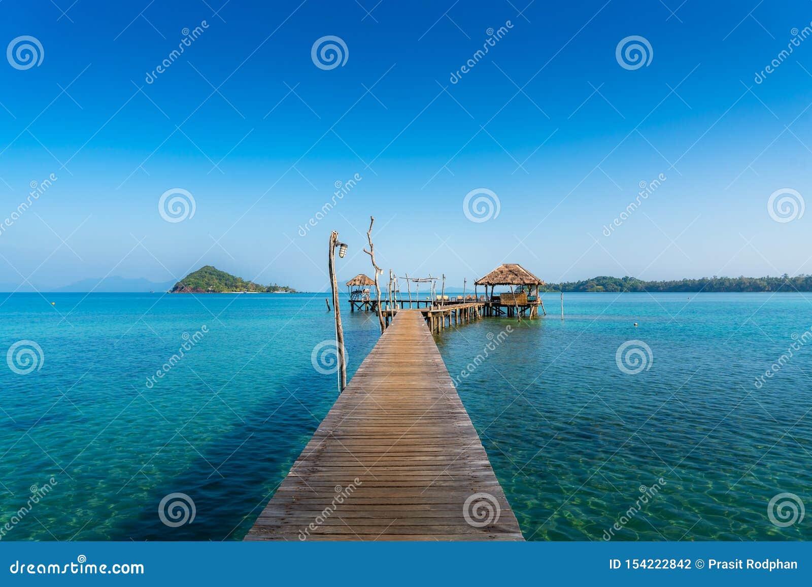 wooden bar in sea and hut with clear sky in koh mak at trat, thailand. summer, travel, vacation and holiday concept