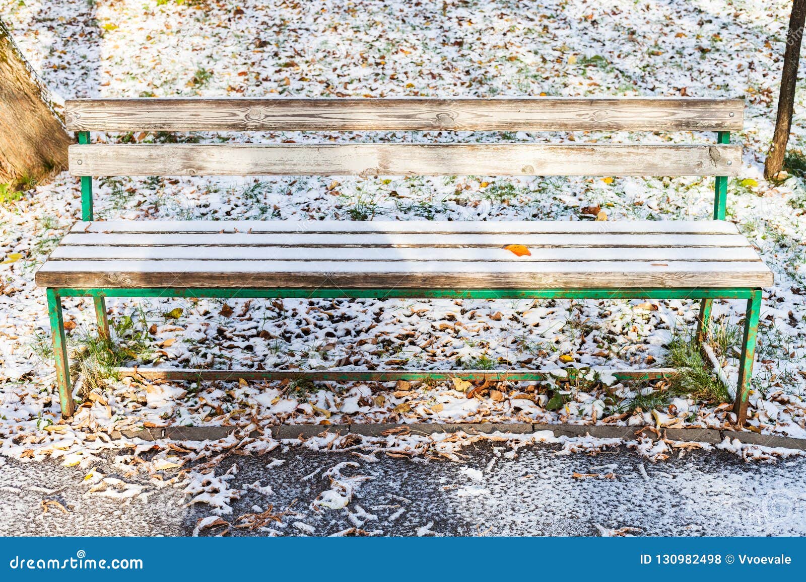 Wooden Bench Covered With Snow In Urban Garden Stock Photo Image