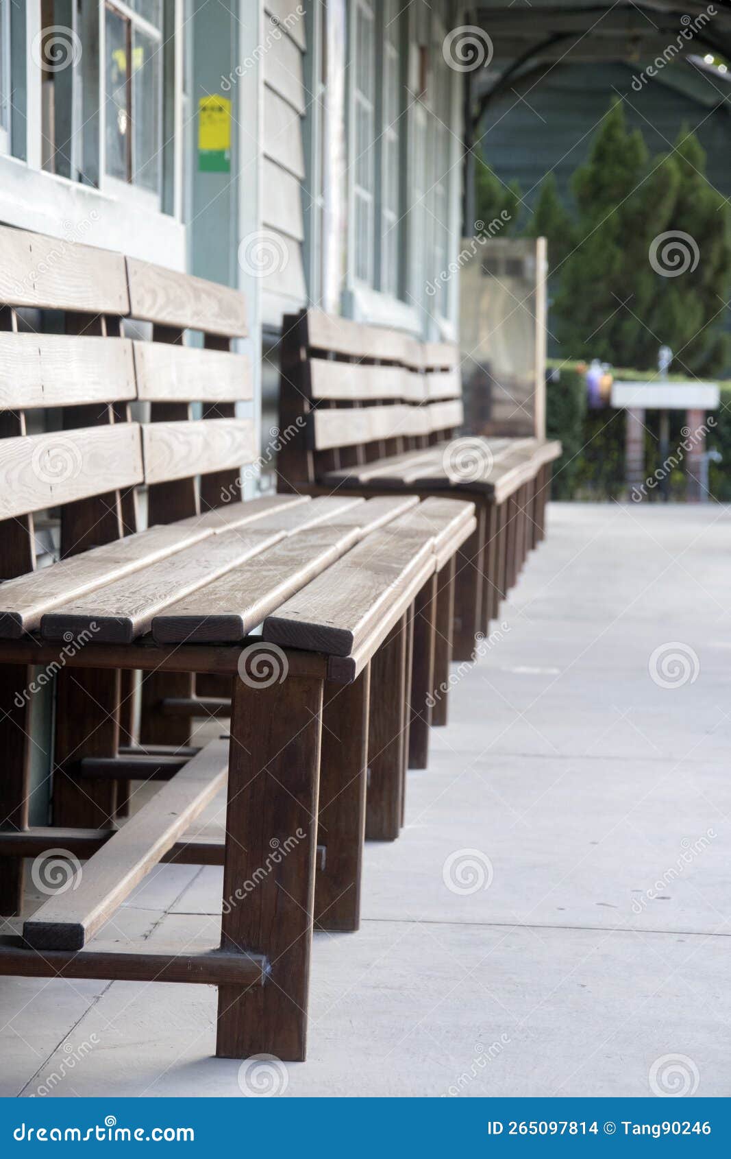 wooden bench at the waiting area for north gate station