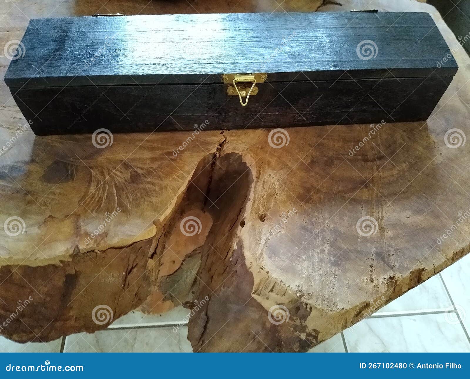 the wooden black box on the table