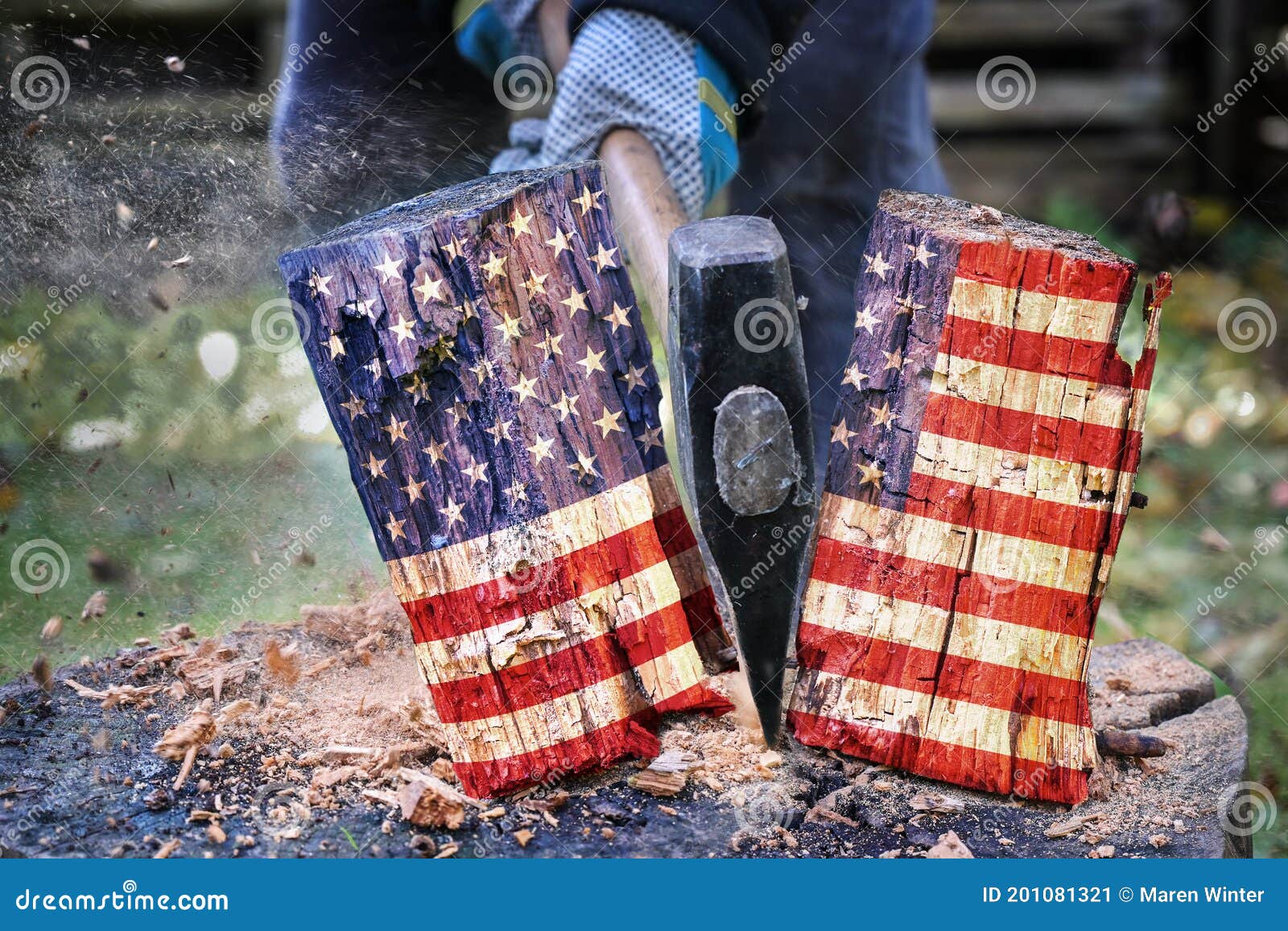 wooden block with american flag is split in two halves with an axe, metaphor for the divided country after the election