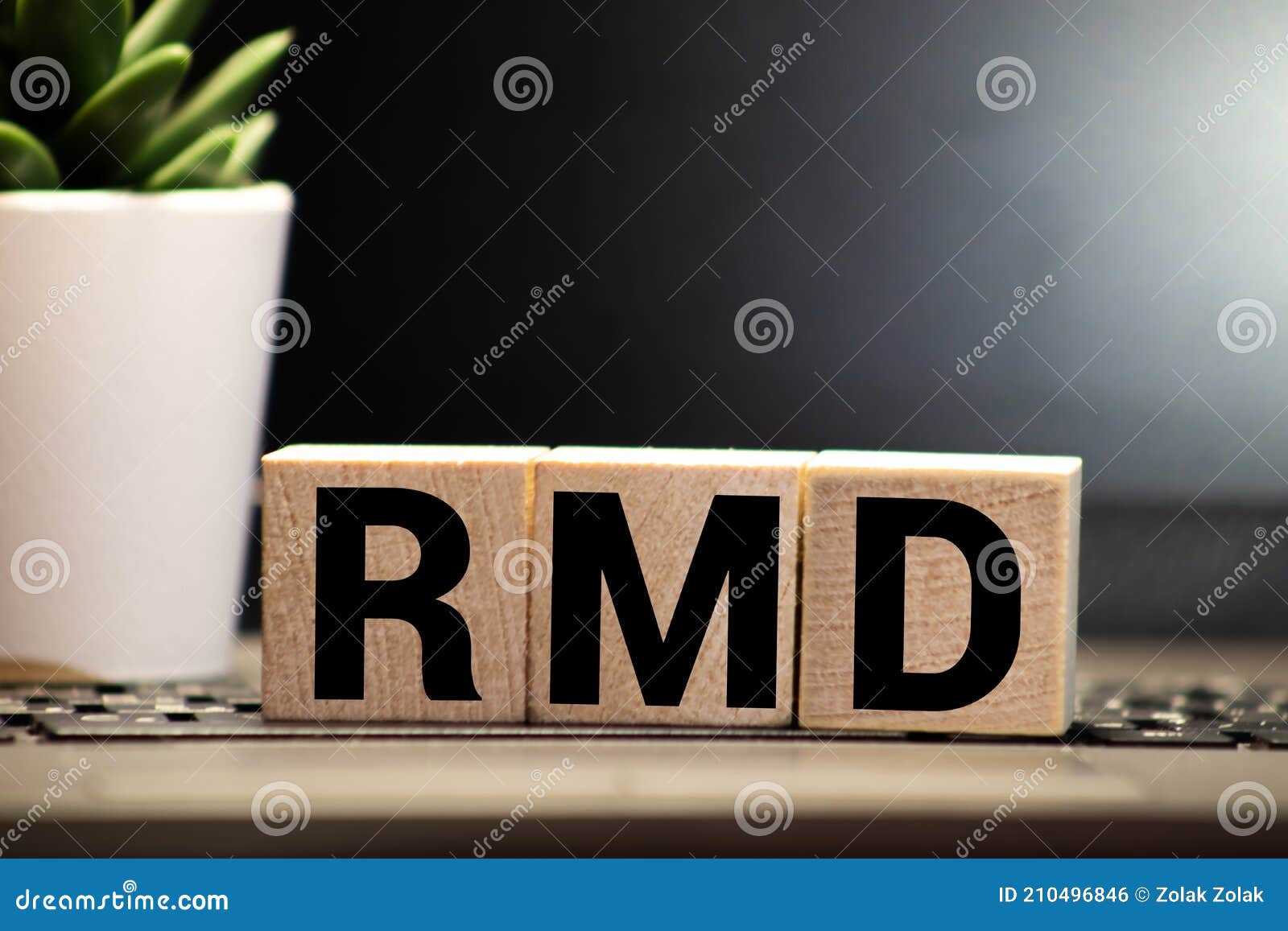 wooden block with words rmd required minimum distributions