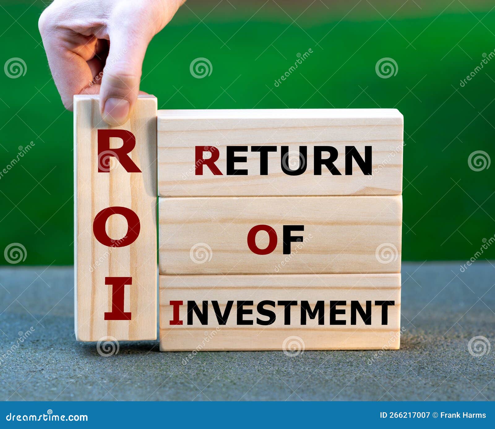 Wooden Blocks Form the Expression `return of Investment` ROI. Stock