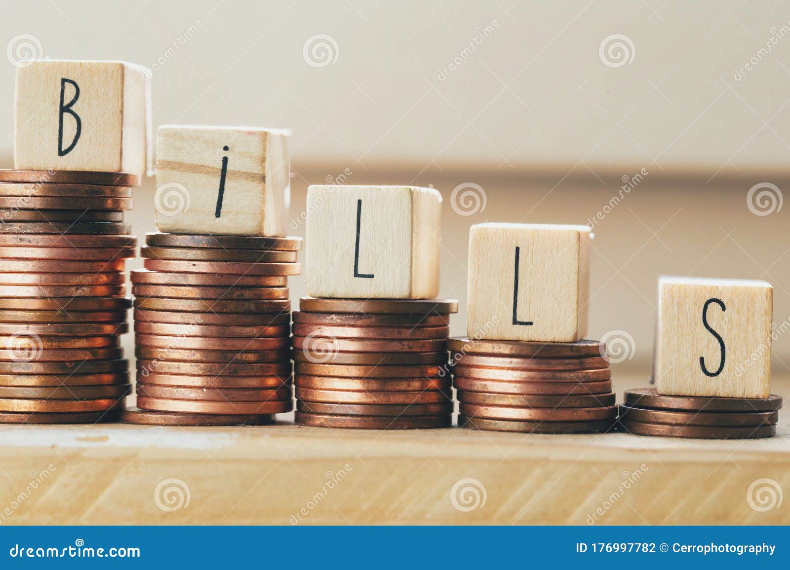 Wooden Blocks With The Word Bills And Pile Of Coins, Money ...