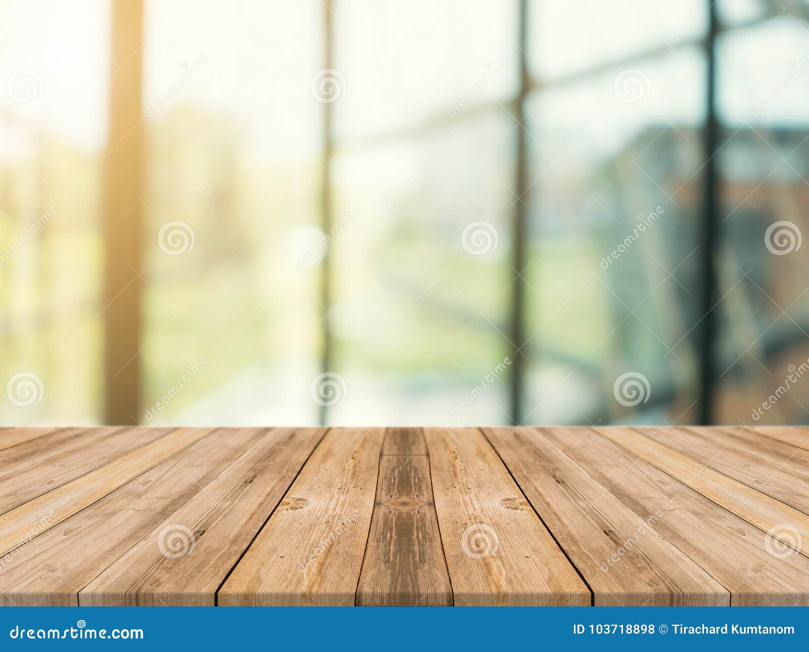 wooden board empty table top on of blurred background. perspective brown wood table over blur in coffee shop background.