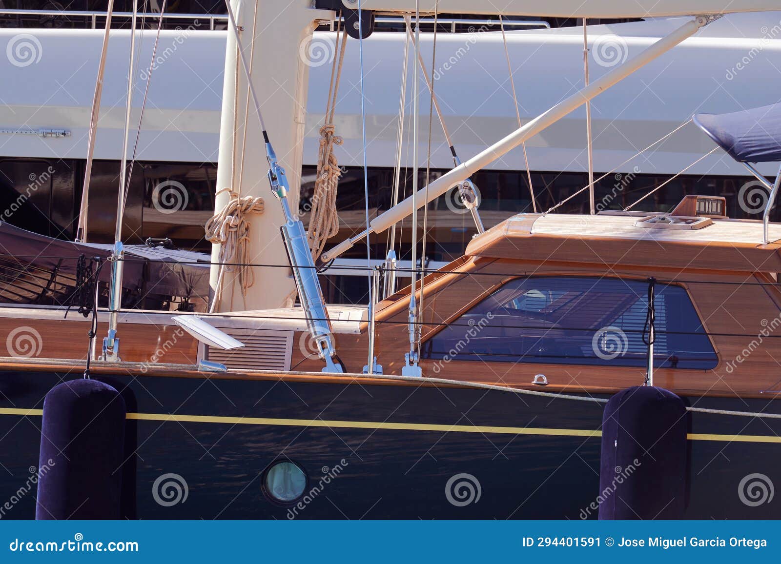 wooden boat docked in the marina