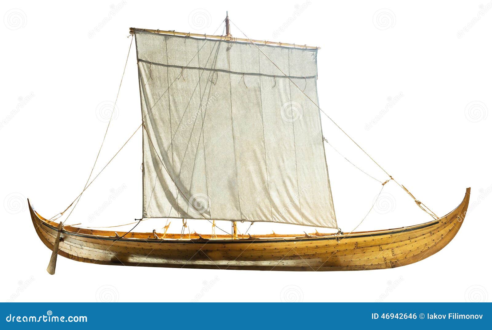 wooden boat with sails unfurled