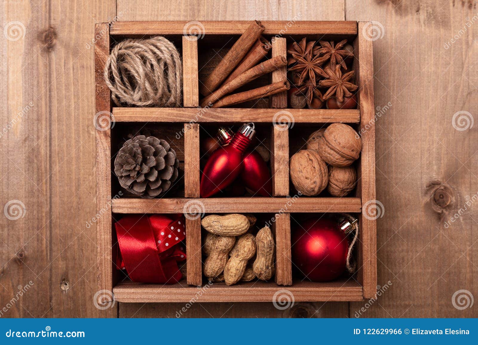 Wooden Box with Christmas Decorations on Wooden Table. Stock Photo