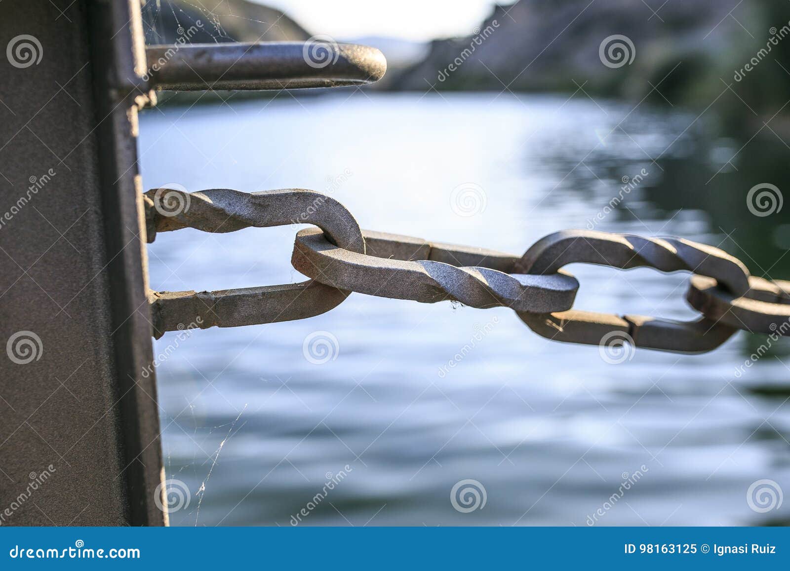 wooden bridge chains in a river of pirineos