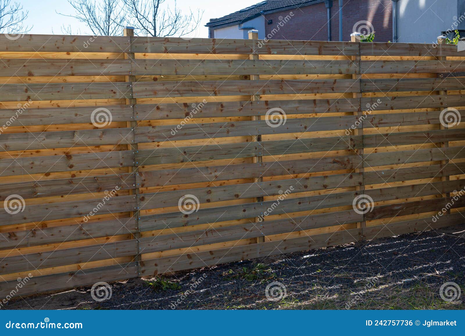 wooden build fence in a garden in hoofddorp the netherlands after storm damage taken by storm corrie, eunice, dudley and franklin.