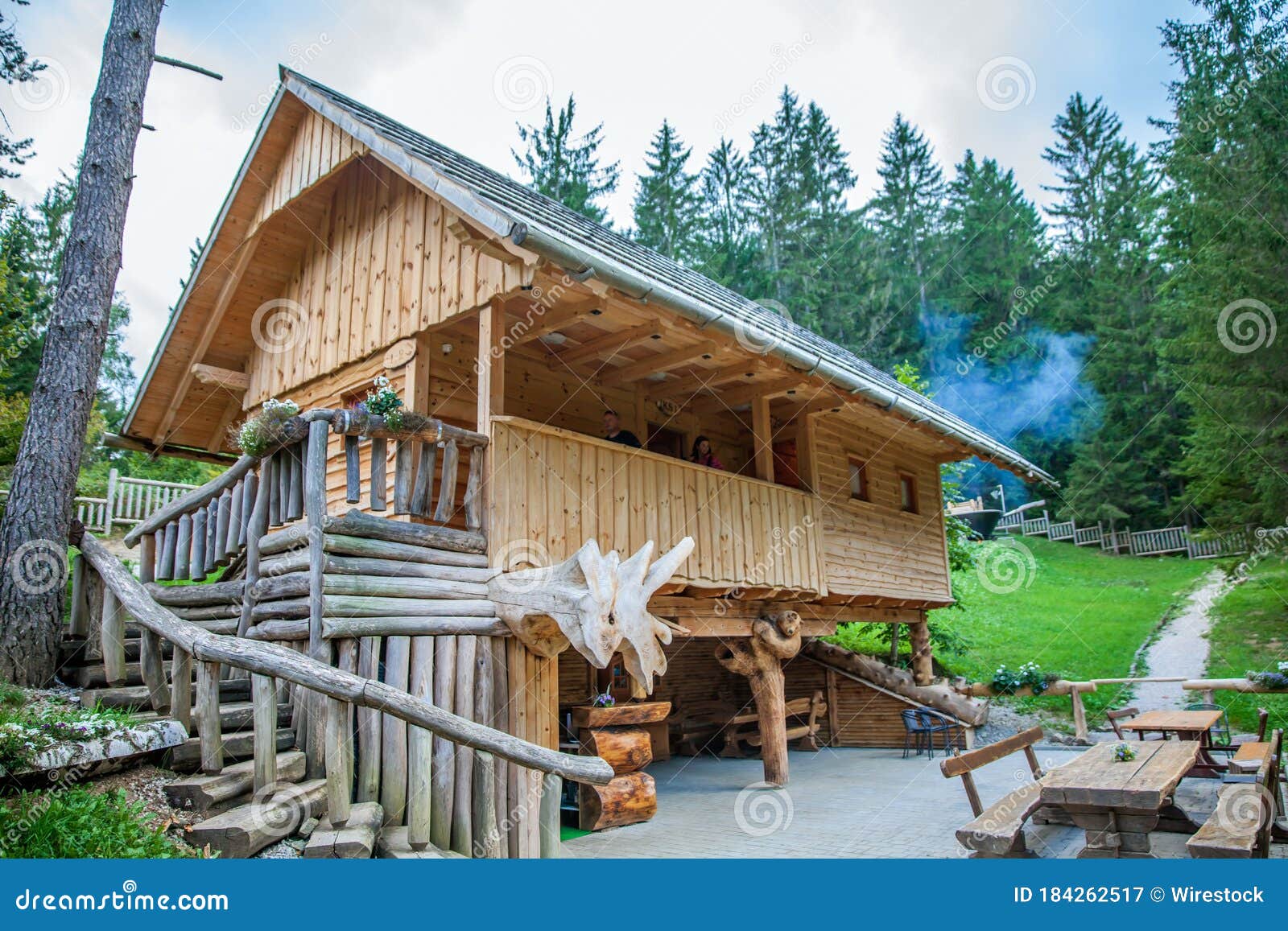 wooden cabin with tourists at hija glamping lake bloke in nova vas, slovenia