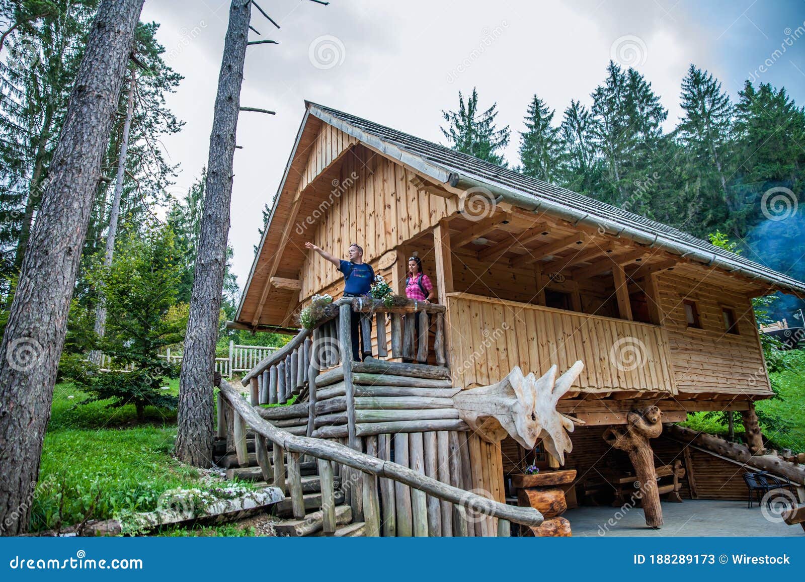 wooden cabin with tourists at hija glamping lake bloke in nova vas, slovenia
