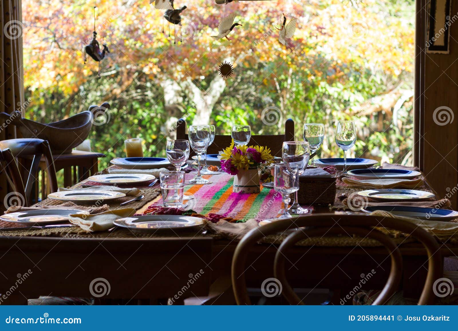 wooden chairs and table set for family reunion meal