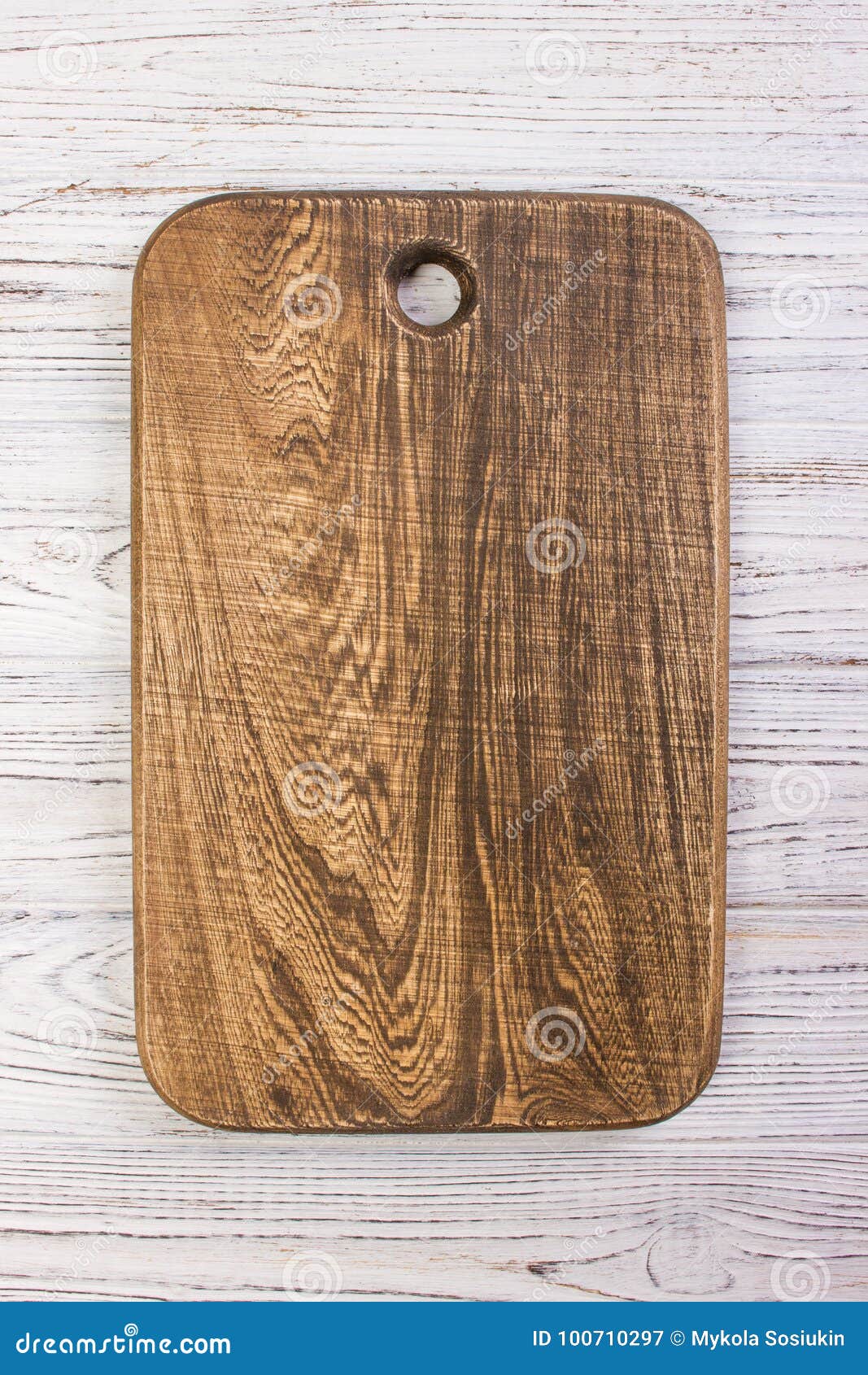 Wooden Chop Board on Rustic Wooden Table Top. Top View Stock Image