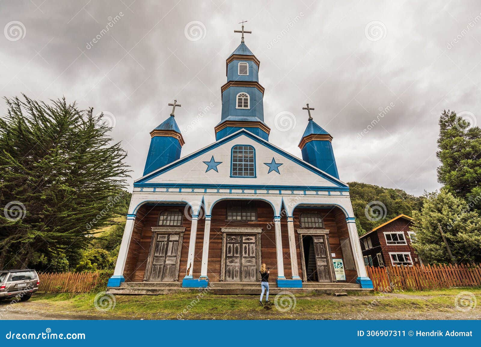 wooden church nuestra senora del patrocinio in tenaun on chiloe with a white facade, blue stars and steeples and white