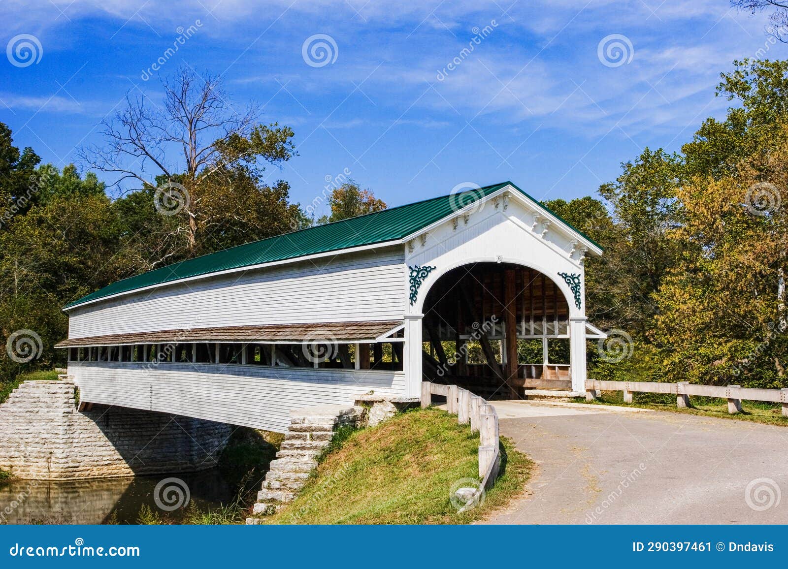 a wooden covered bridge in the countyside of rural america