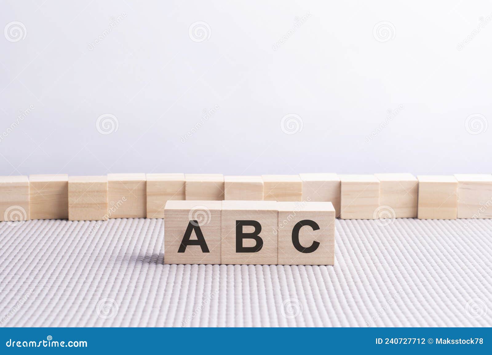 wooden cube with the letter from the abc word. wooden cubes standing