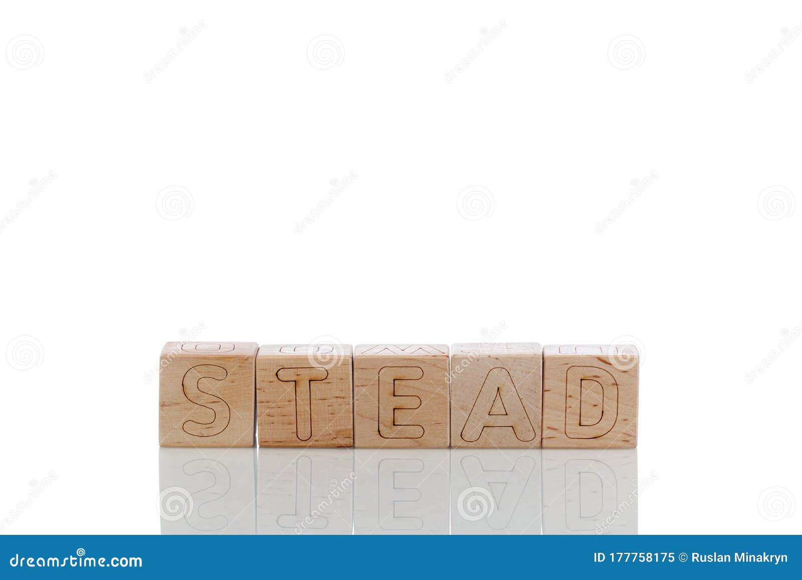 wooden cubes with letters stead on a white background