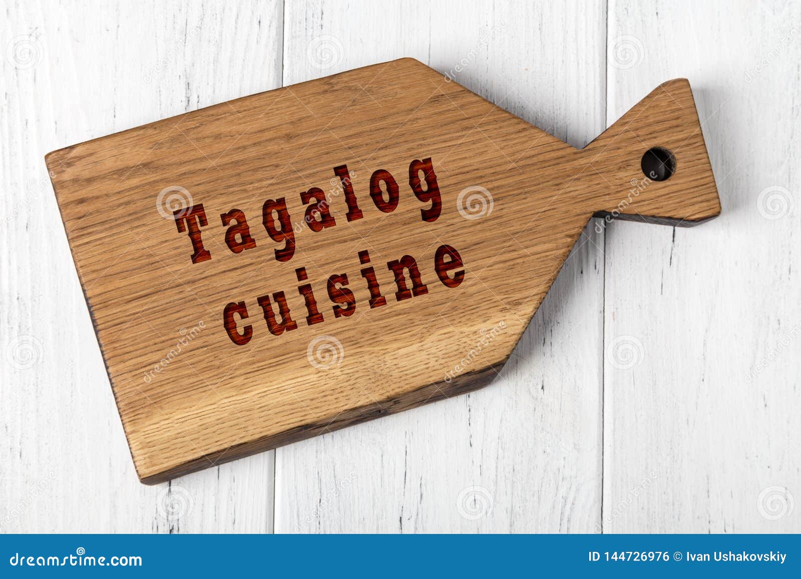 wooden cutting board with inscription. concept of tagalog cuisine