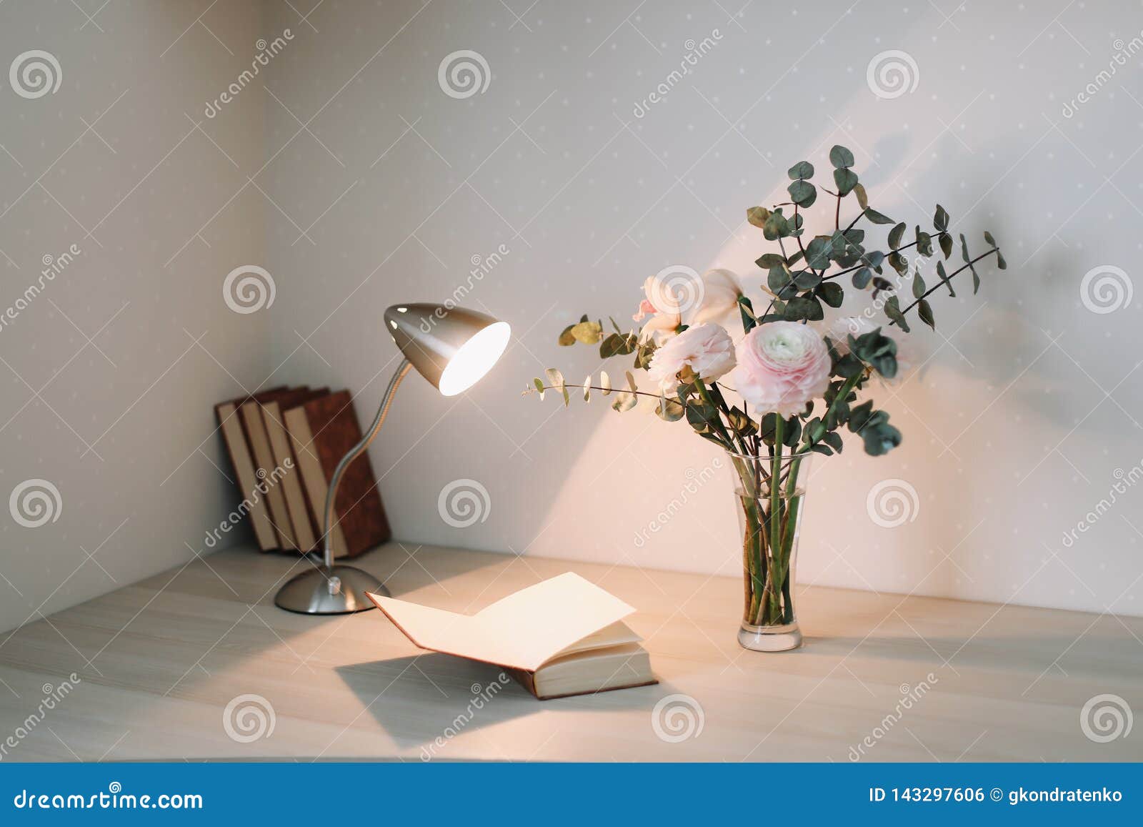 Wooden Desk with Books and Flowers. Bouquet and Books on White ...