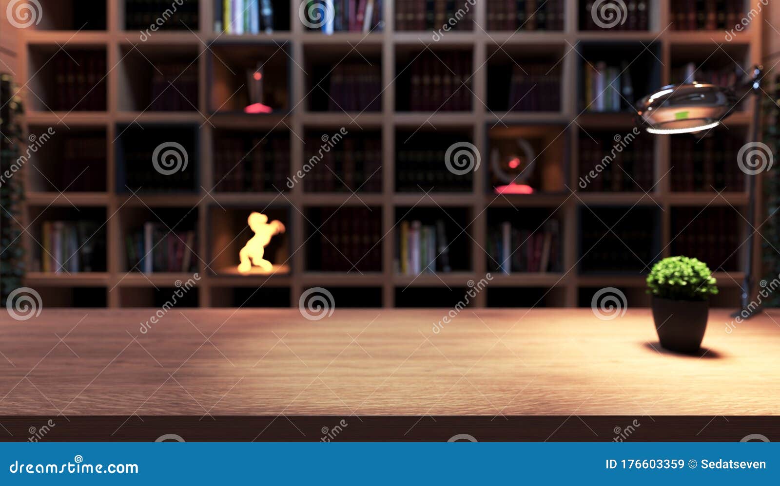 wooden desk, plant and table lamp front of bookshelf from library