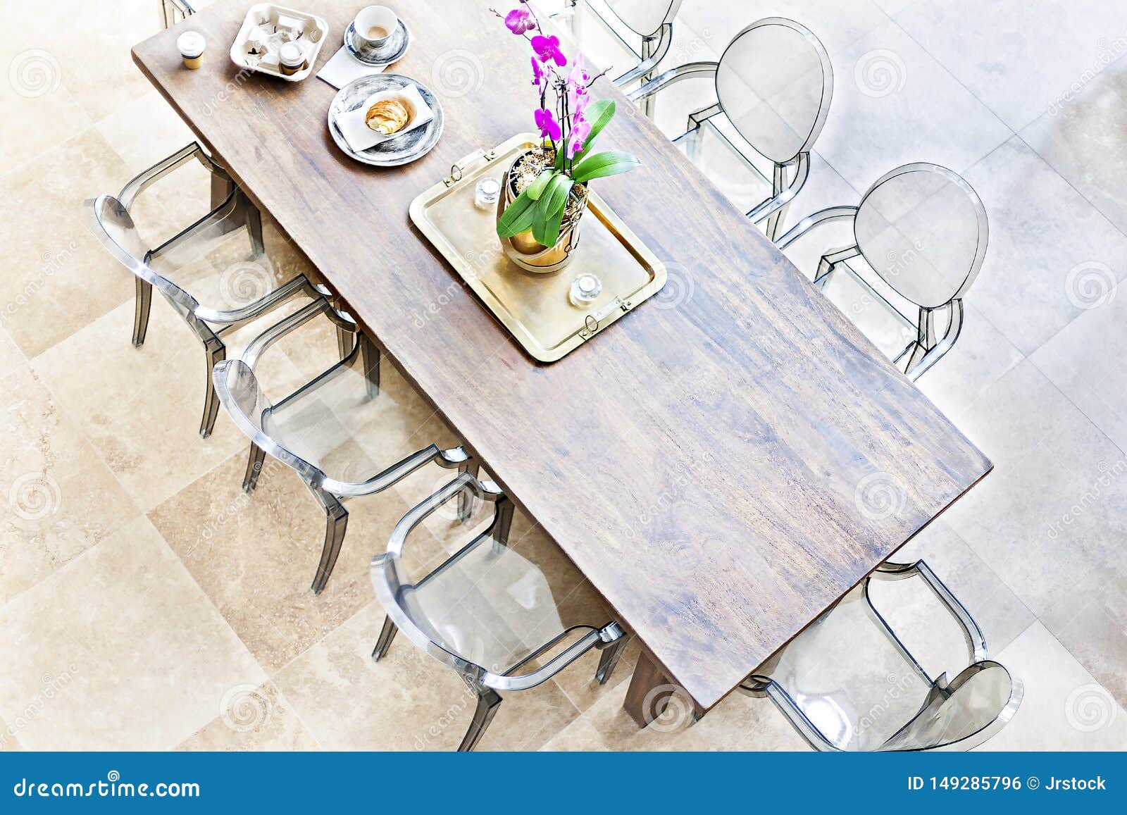 Wooden Dining Table Above View with Plastic Chairs Stock Photo - Image